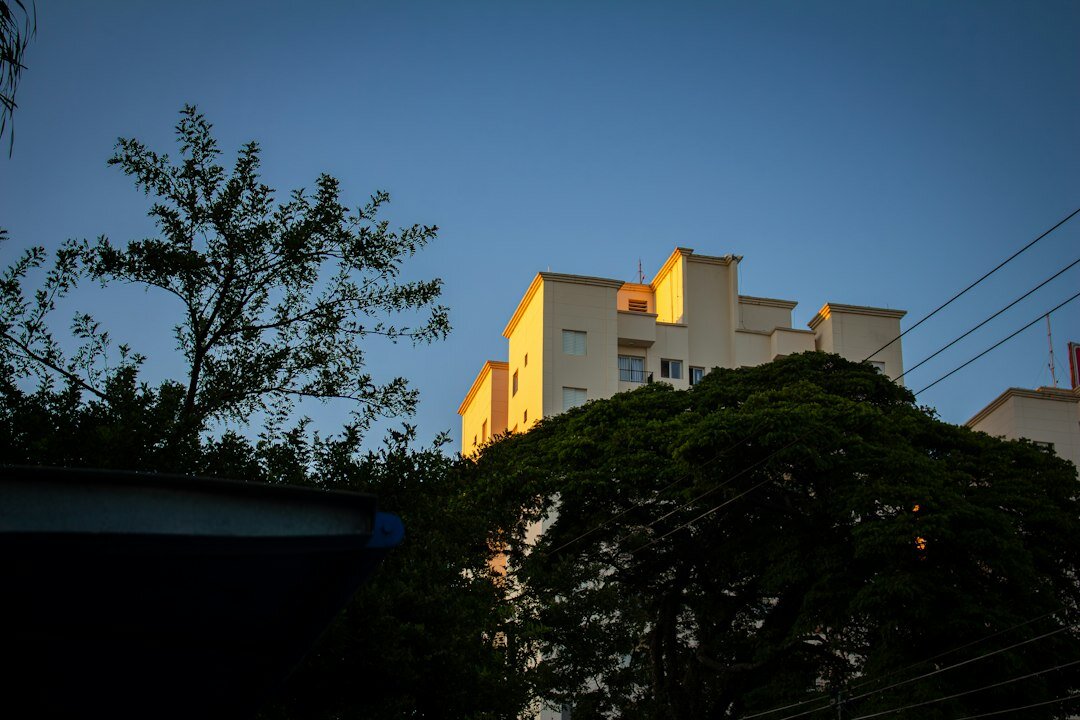 Dense apartment rooftops in a South American city at dusk